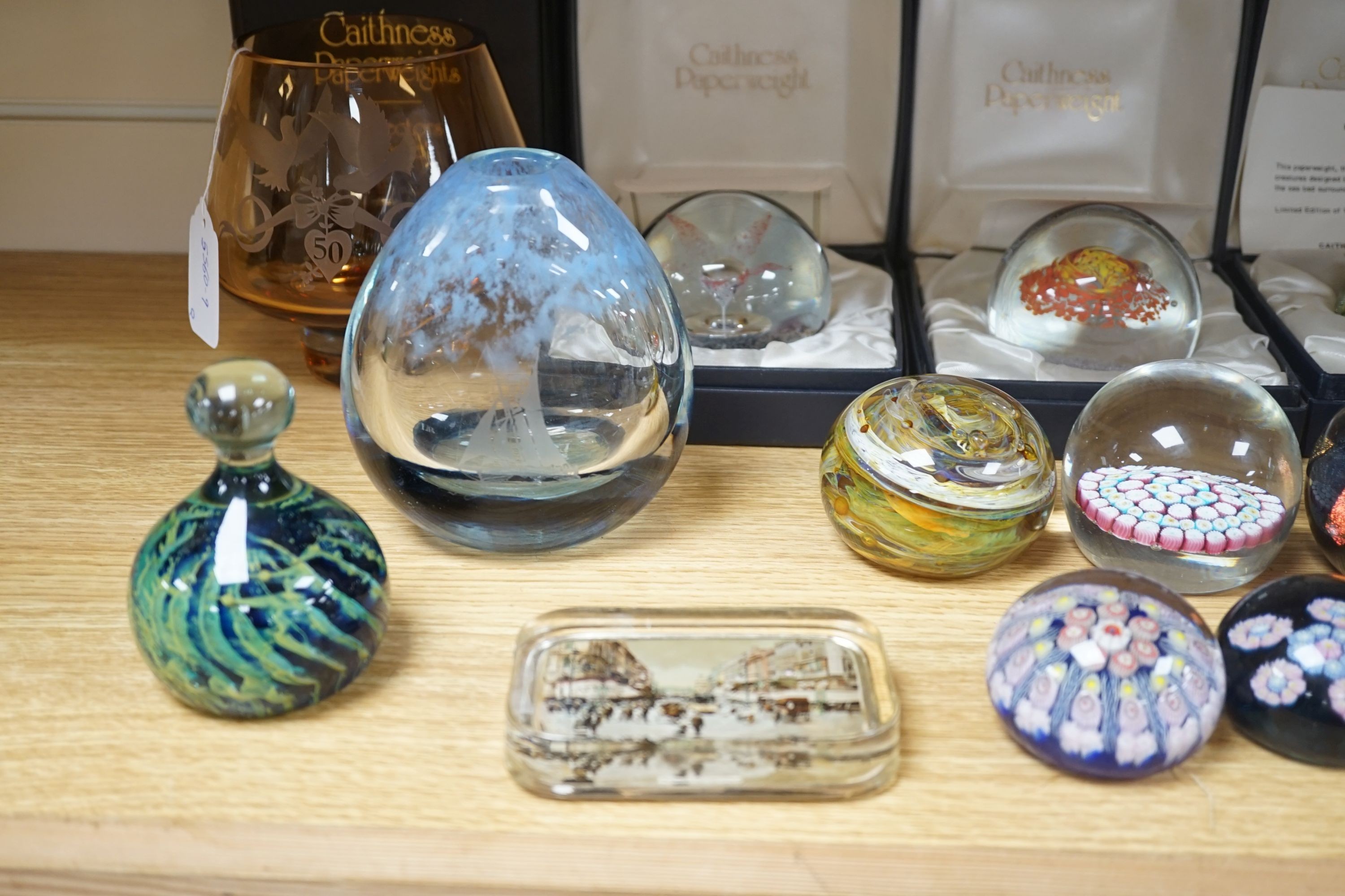 2 Caithness glass vases together with 11 various paperweights, including 3 boxed Caithness and a Baccarat paperweight.